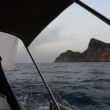 In de prille ochtend ronden we kaap Teulada, zuidelijke punt van Sardinië, op weg naar Menorca