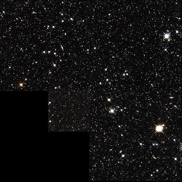 Recente opname van het Draco dwergsterrenstelsel. Het grootste deel ervan zou uit onzichtbare donkere materie bestaan, dus je ziet niet veel (foto Wikipedia)